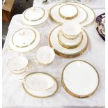 A Minton 'Milford' pattern table service comprising dinner plates, tureens, serving dishes, etc.