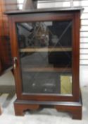 Two oak stools and a dwarf cabinet enclosed by glass panelled door,