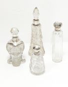 Three cut glass dressing table bottles with silver mounts and one other