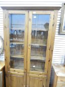 A pine bookcase display cabinet,