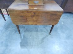 A mid 19th century mahogany Pembroke table fitted one drawer and one dummy drawer to frieze,