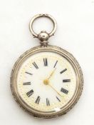 A silver fob watch with white face, Roman numerals, gold decoration,