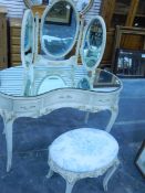 An Antoinette-style kidney-shaped bevel mirror topped dressing table fitted three drawers together