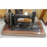 Old iron sewing machine in inlaid case and two mirrors