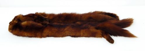 Two vintage fur tippets and a vintage fur muff with a zip,