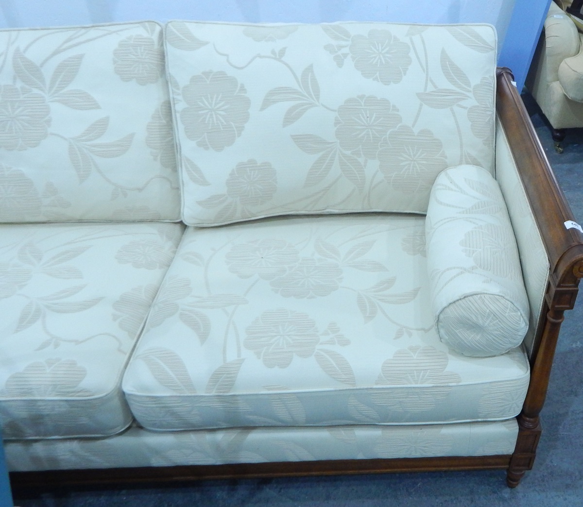 A curved back wrap-round three seat settee upholstered in a floral fabric together with four loose