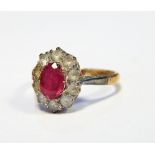 Pink stone and diamond cluster ring set oval facet-cut pink stone,