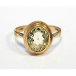 9ct gold and pale green stone solitaire ring,