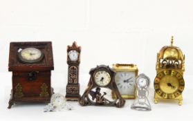 A quantity of carved wood and other decorative items including brass lantern clock,