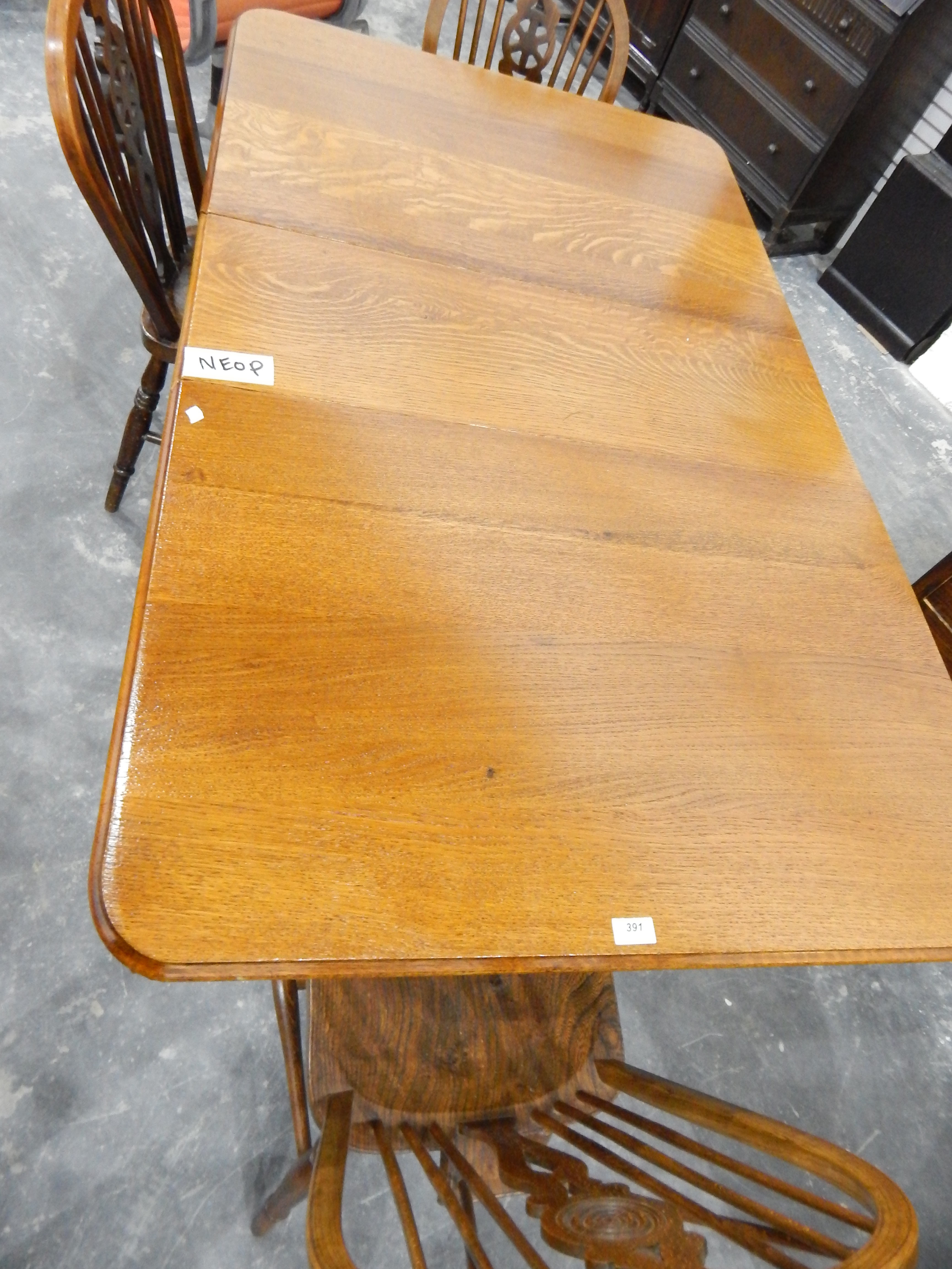 A mid 20th century oak fall-flap dining table - Image 2 of 2