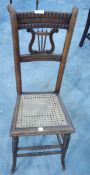 19th century mahogany child's correction chair with cane seat,