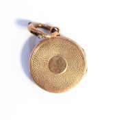 10k gold engine-turned locket, circular, approx. 3.