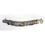 A silver and enamel bracelet with numerous armorial shields,