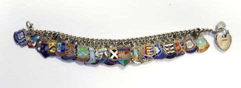 A silver and enamel bracelet with numerous armorial shields,