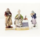 A Meissen style figure of a lady seated at a dressing table, 14cm high,