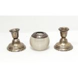 A pair of silver dressing table candlesticks of circular form and a silver mounted glass vesta