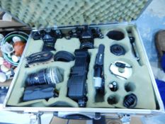 A fitted case with SLR cameras and accessories together with further cameras, lenses, etc.
