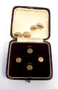 Set of four gold coloured studs,