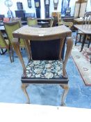 A cane seat dressing stool on tab legs and another stool with woolwork embroidered seat and on