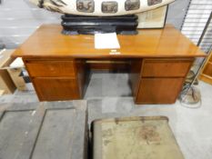 Heals 1950's teak kneehole desk with four flanking drawers,