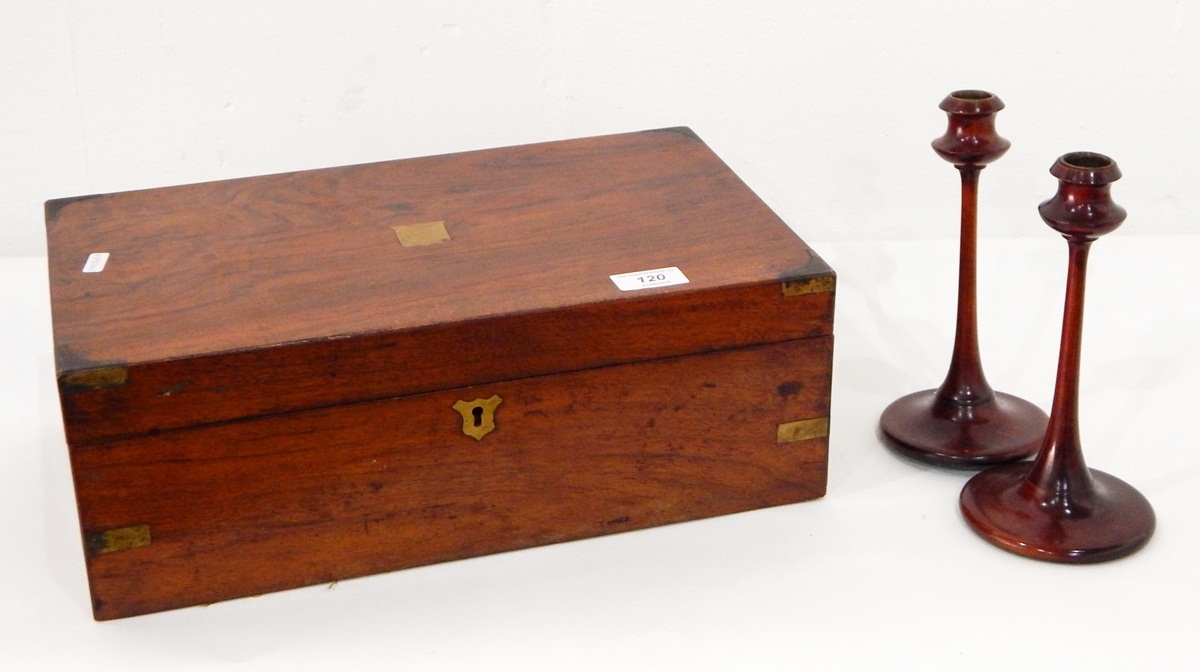 A mahogany writing slope with missing felt insert together with two carved mahogany candlesticks,