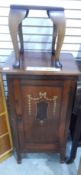 An Edwardian inlaid mahogany bedside cupboard and a stool (2)