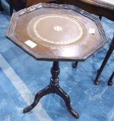 A mahogany wine table with turned column and tripod supports