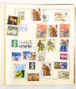 Two stamp albums containing world stamps, Malta, Rhodesia and Naisaland, Holland,