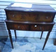 A reproduction mahogany desk, the writing front enclosing a fitted interior with writing surface,