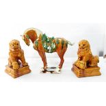 A Chinese pottery replica model of a "Tang" horse (af) and a pair of pottery models of Dogs of Fo