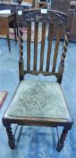 Three oak framed dining chairs with carved crest rails,