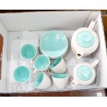 A Poole pottery coffee service, pale outer with duck-egg blue inner, including hot water jugs,
