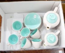 A Poole pottery coffee service, pale outer with duck-egg blue inner, including hot water jugs,