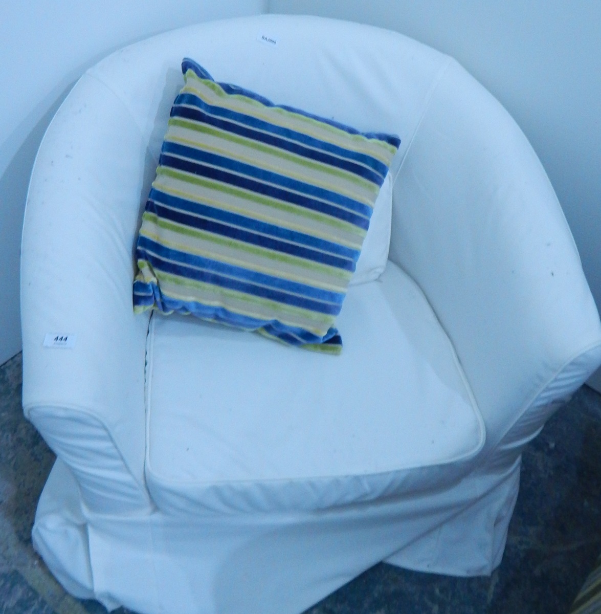 Upholstered tub shaped easy chair