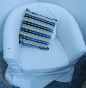 Upholstered tub shaped easy chair