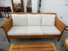 An Arbor Vetum hardwood conservatory suite comprising three seat settee and two armchairs,