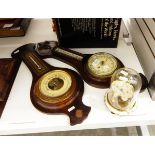 Two stained wood aneroid barometers and a Schatz perpetual timepiece