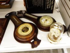 Two stained wood aneroid barometers and a Schatz perpetual timepiece
