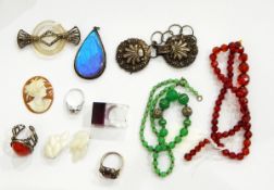 Assorted costume jewellery including a silver buckle with shell decoration,