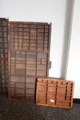 A set of wooden specimen shelves made from printers drawer and another,