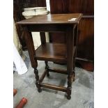 A small oak side table with undershelf,