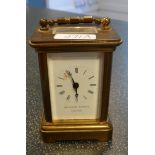 A small brass carriage timepiece