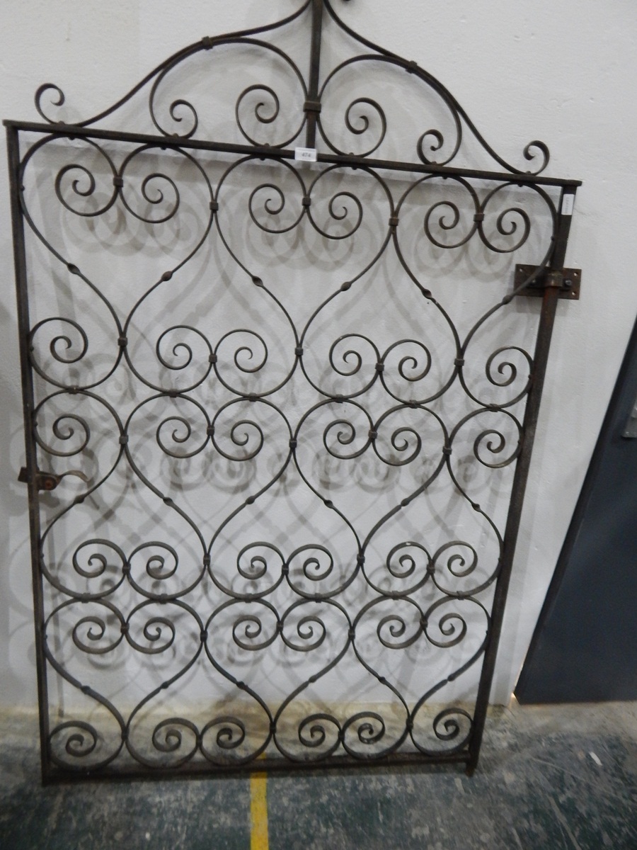 A cast iron gate with scroll pattern,