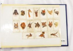 Two albums of early/mid 20th century cigarette cards including views, humour, celebrities, etc.