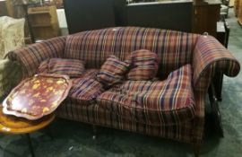 A modern two seater sofa with tartan cover,