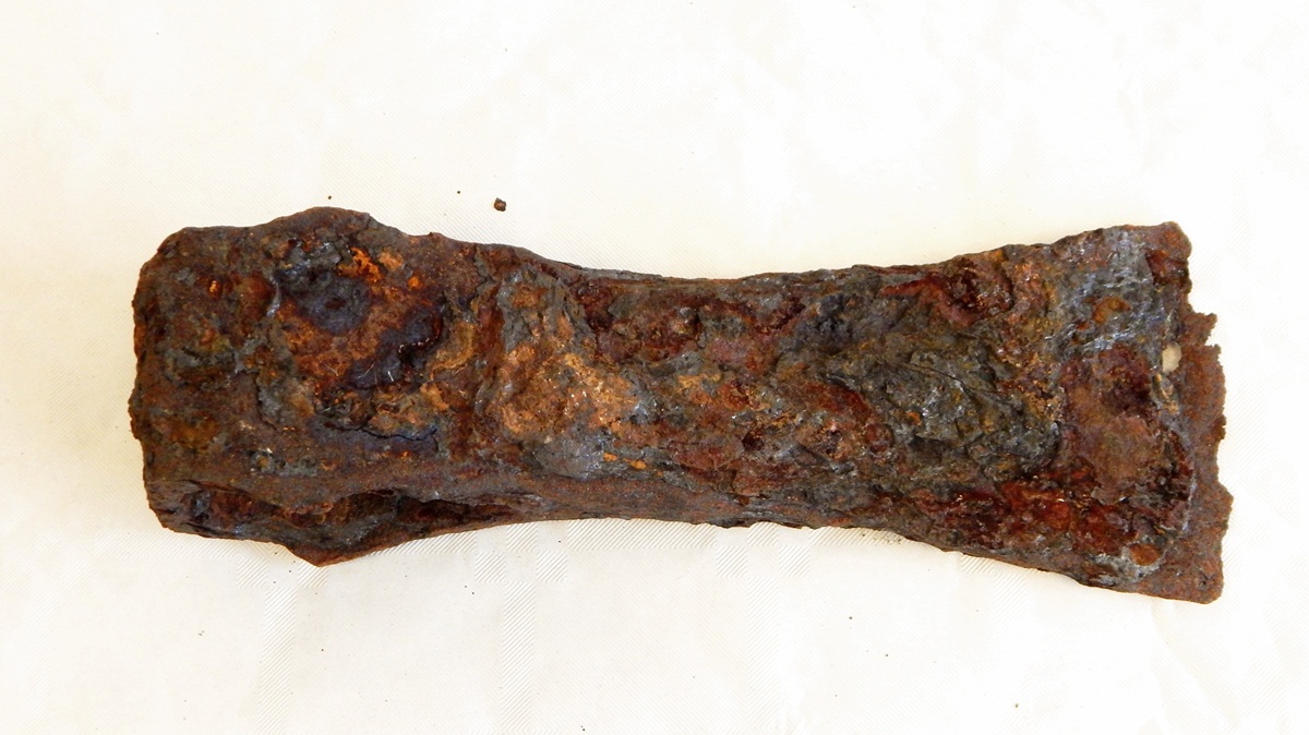 An ancient iron axe head with loop
