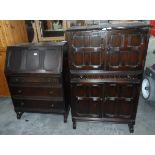 A reproduction stained oak bureau,