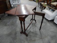 An oak Pembroke table on turned and bobbin supports and castors (one leaf is completely detached)