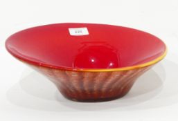 A heavy cased glass flared rim bowl, red and yellow rim and mottled underneath,