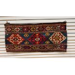 An Anatolian Kelim bedding bag face with red and cream medallions,